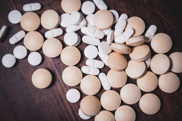 Pills representing the dangers of drug interaction and self-medication