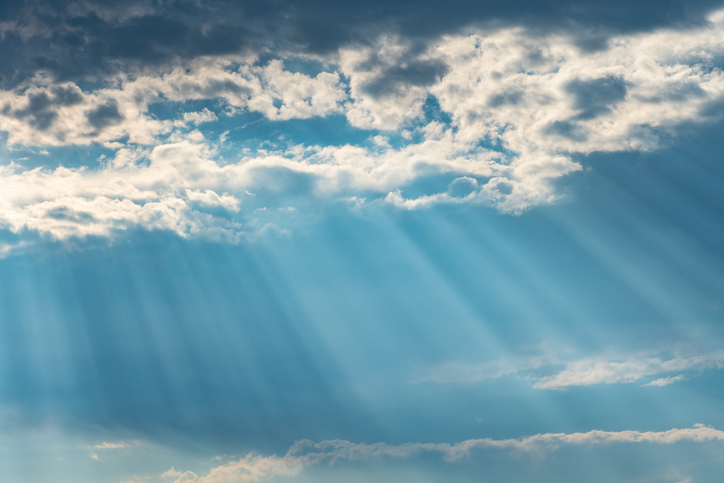 Low angle view of sunlight streaming through clouds,Indonesia