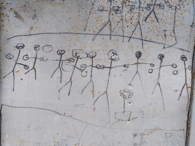 scribbles of a child's hand on the wall.