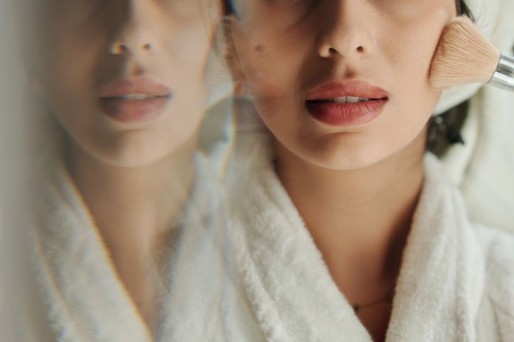 Woman Applying Face Powder with Brush