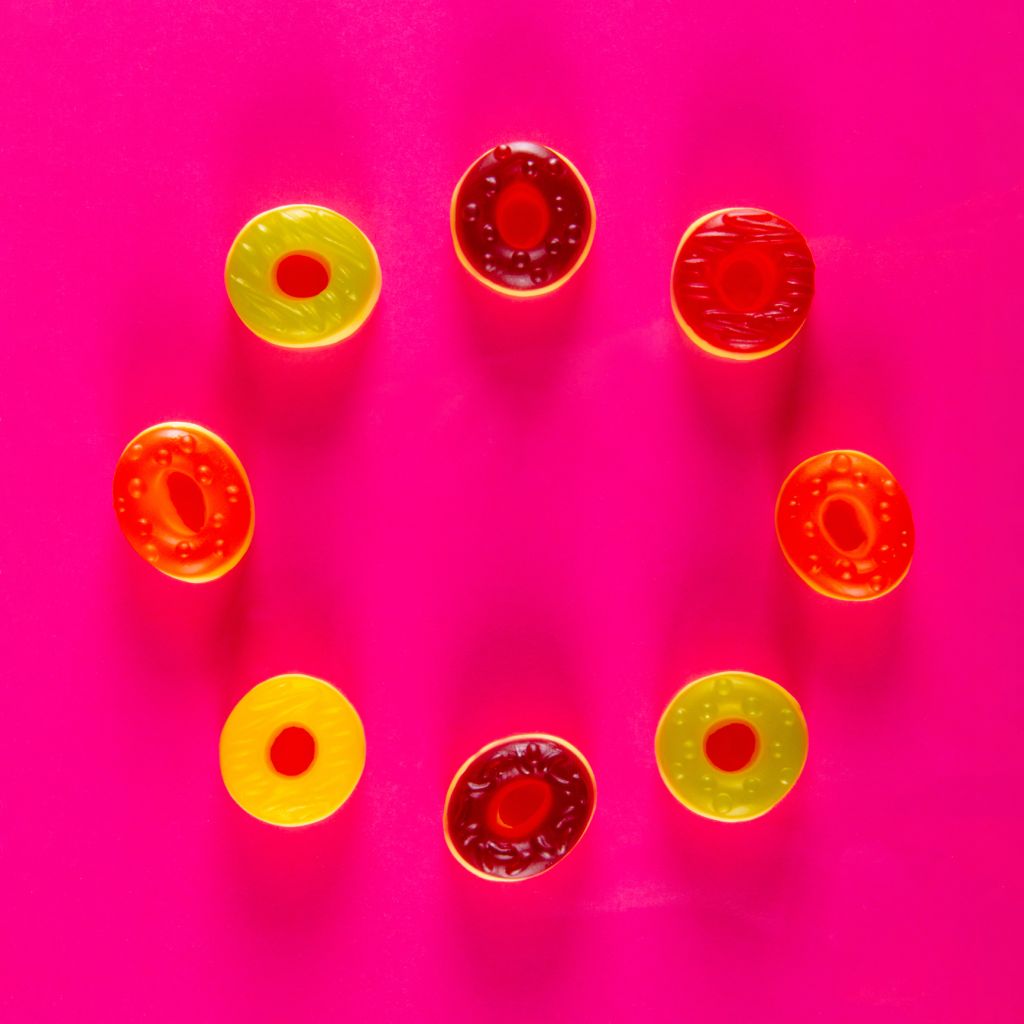 Jelly candies on bright colorful background