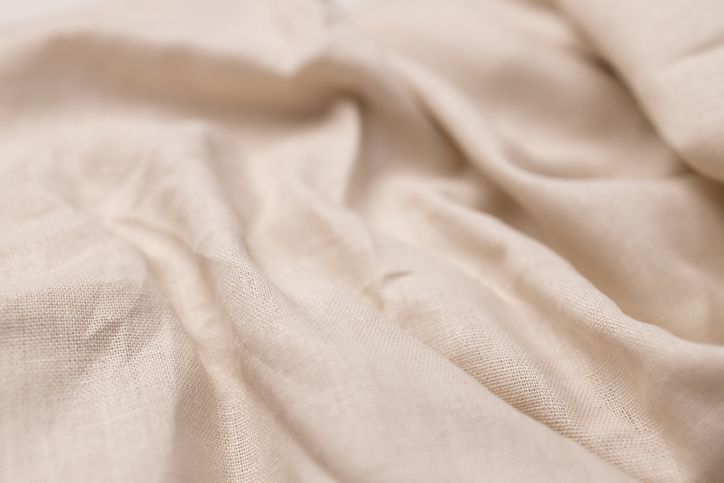 Natural linen fabric texture. Rough crumpled burlap background