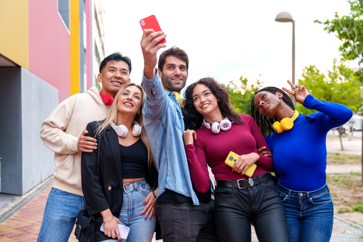 Vibrant Multiracial Five Friends Capturing Joy in Colorful City Selfie