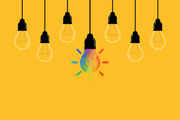 Creative Idea Concepts with Light Bulb on Yellow Background