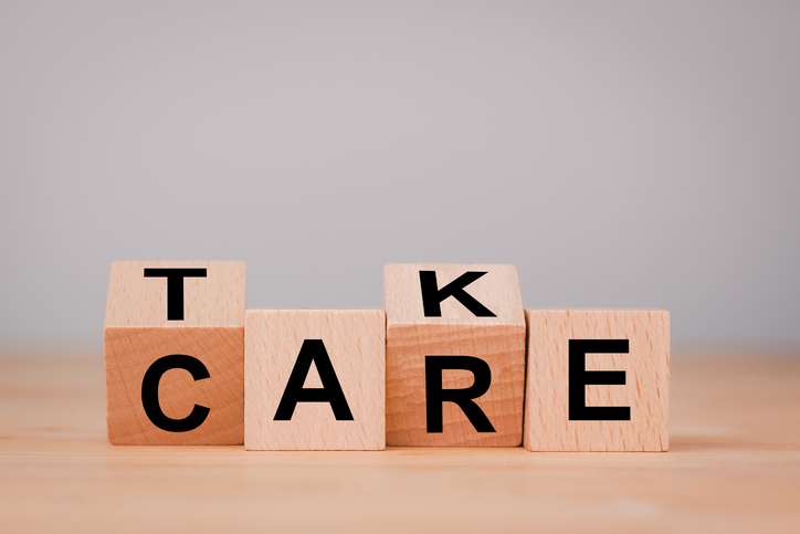 Health care concept. Flipping of take care yourself wording which print screen on wooden cubes blocks on table.