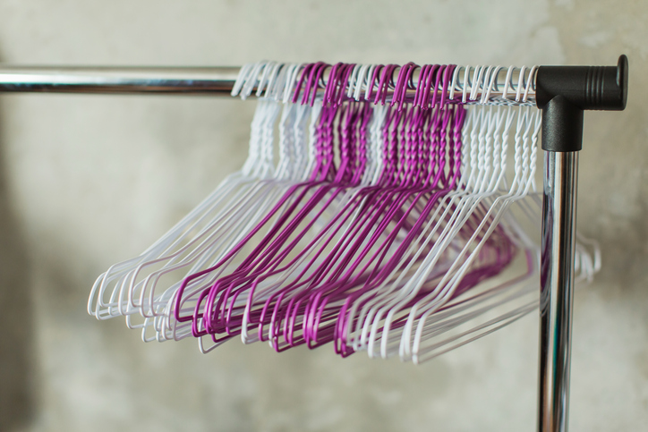 Clothes hanger on gray wall background