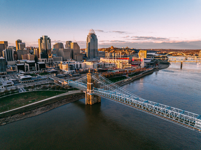 The John A. Roebling Suspension Bridge Crossing the Ohio River into Downtown Cincinnati at Sunset