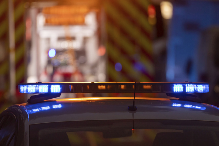 Blue and red police flashing light at night time. Mid shot