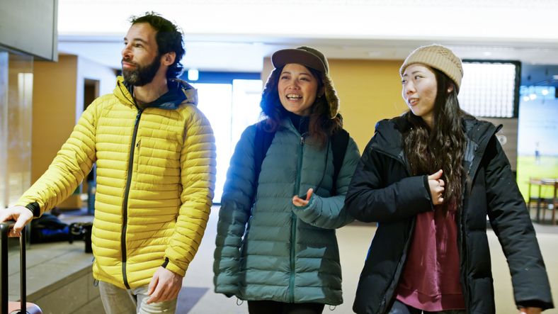 Three Best Friends Walking inside Niseko Hotel Lobby