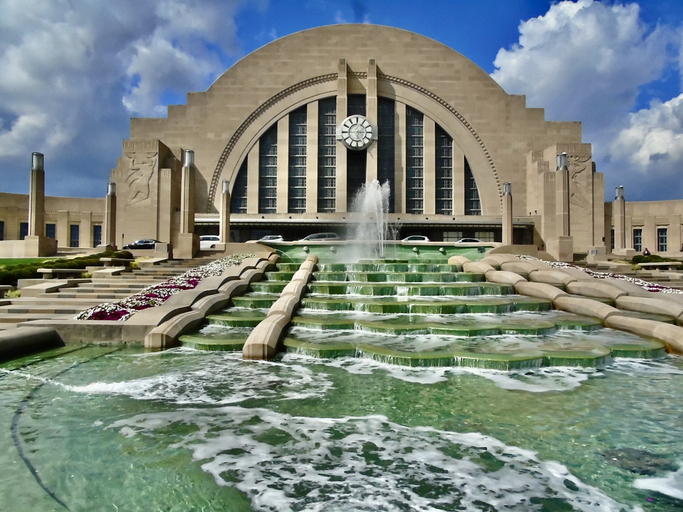 beyond spraying fountain waters, 10:30 reads the clock face on the eastern façade of the cincinnati union terminal building.