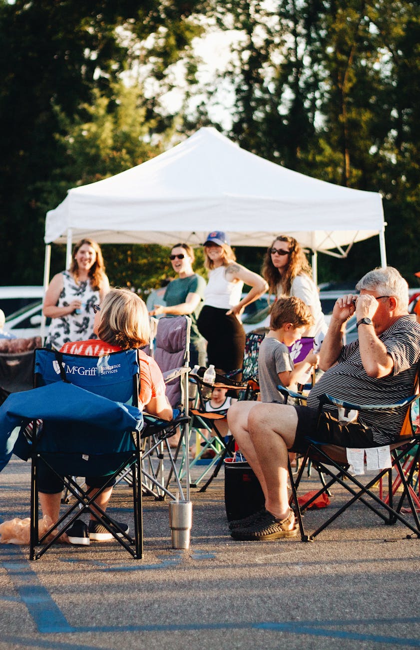 community gathering with outdoor seating and tent