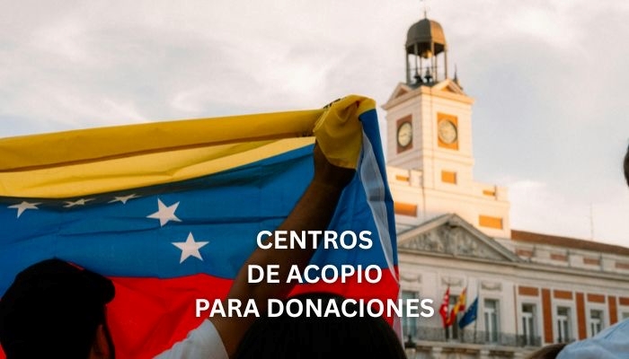 Venezuelan flag with text "CENTROS DE ACOPIO PARA DONACIONES" (Donation collection centers) in front of a clock tower building.