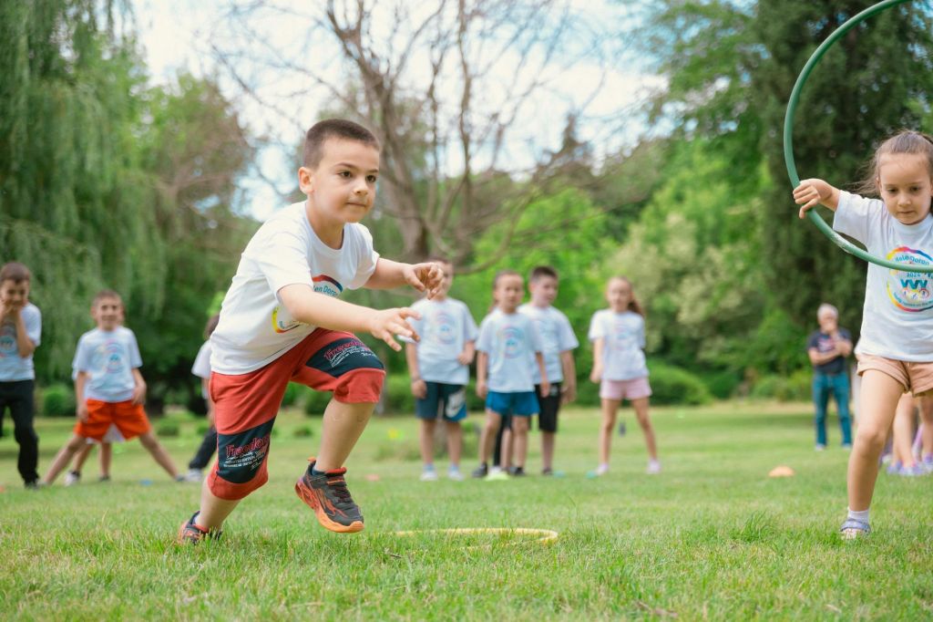 schoolchildren playing and exercising during an outdoor physical education class