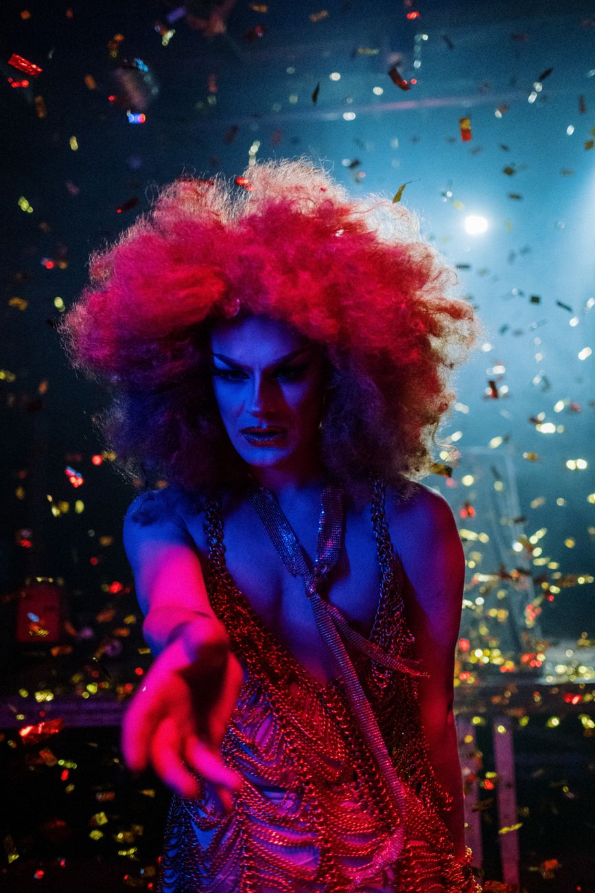 drag queen with an afro wig