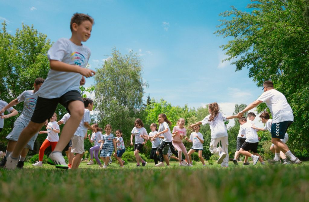schoolchildren playing and exercising during an outdoor physical education class