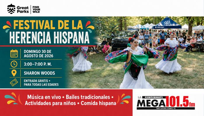 Festival de la Herencia Hispana event with traditional Hispanic dancers performing on stage in a park setting.