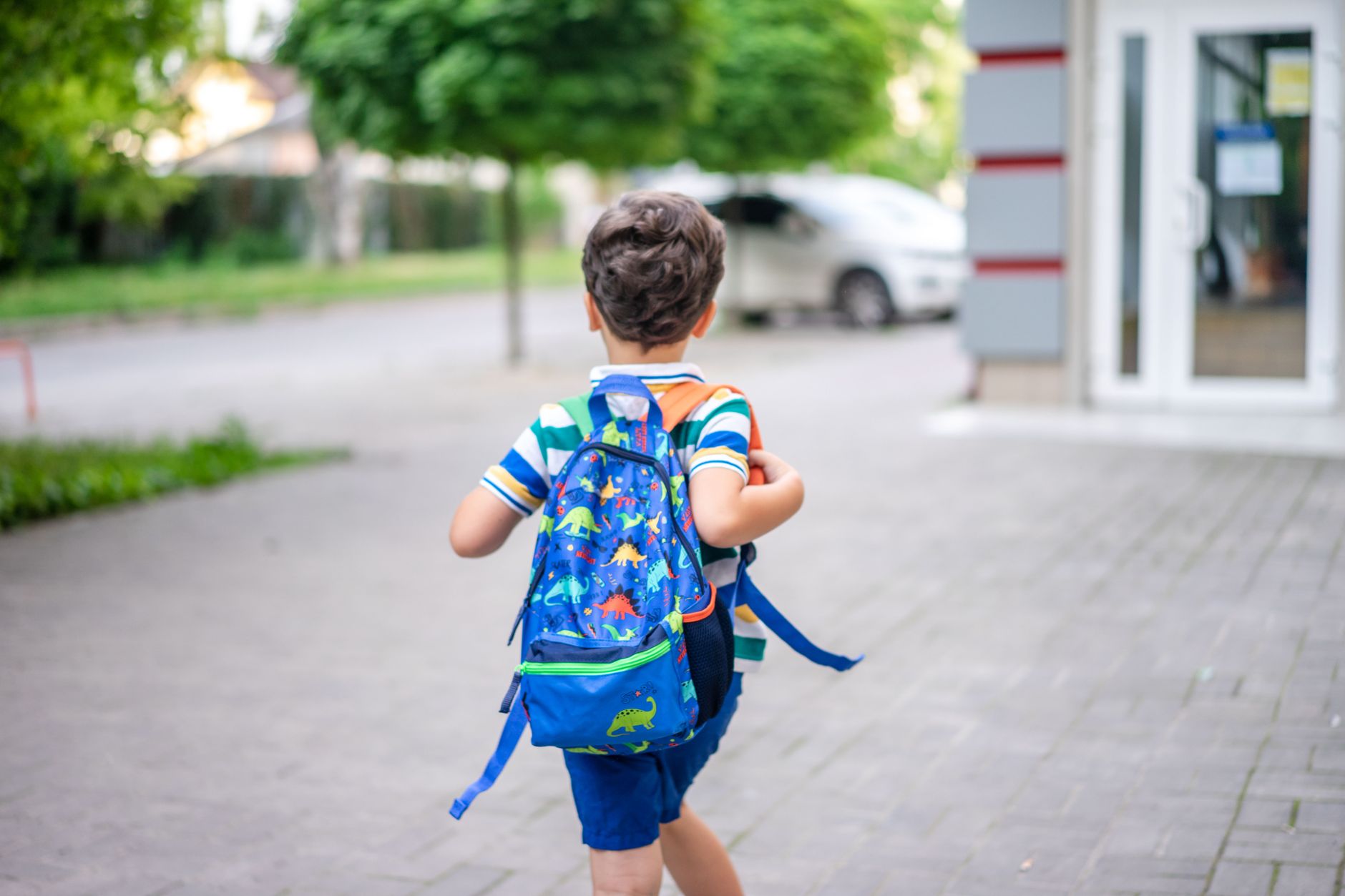 boy with backpack walking
